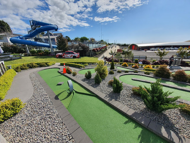 Family playing mini putt